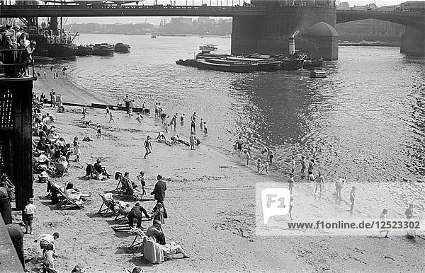 People relaxing on Tower Beach  London  c1945-c1955. Artist: SW Rawlings