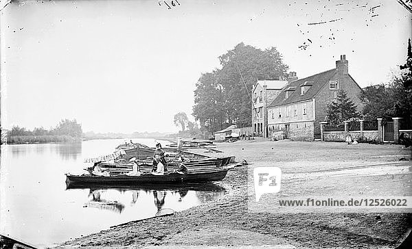 Boats moored on the River Thames near the Anglers Hotel at Walton-on-Thames  Surrey  c1860-c1922. Artist: Henry Taunt