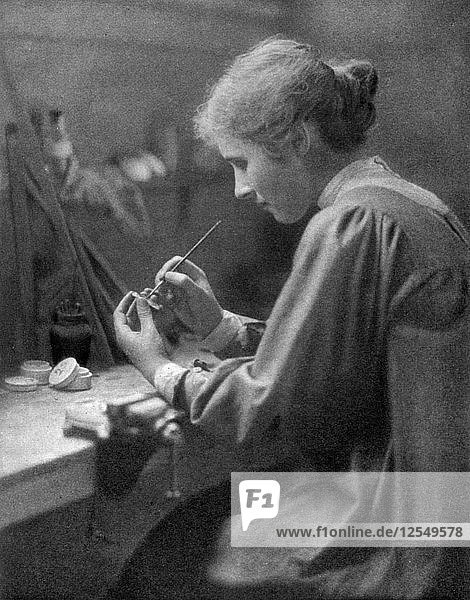 A craftswoman at work  1911-1912.Artist: ET Holding