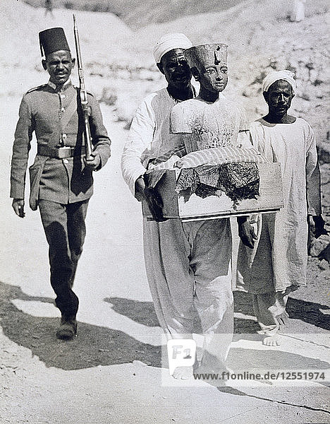Mannequin or bust of Tutankhamun being carried from his tomb  Valley of the Kings  Egypt  1922. Artist: Harry Burton