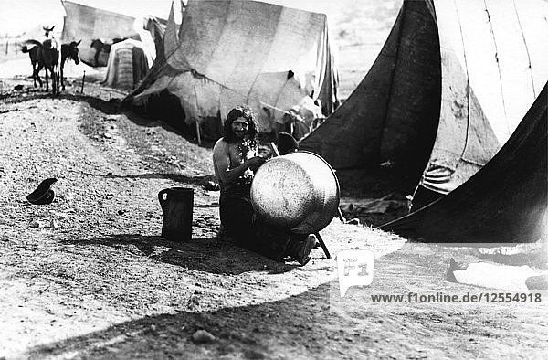 Man with a large pot  Bistrita Valley  Moldavia  north-east Romania  c1920-c1945. Artist: Adolph Chevalier