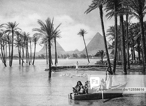 The Pyramids of Giza during a flood  Cairo  Egypt  c1920s. Artist: Unknown