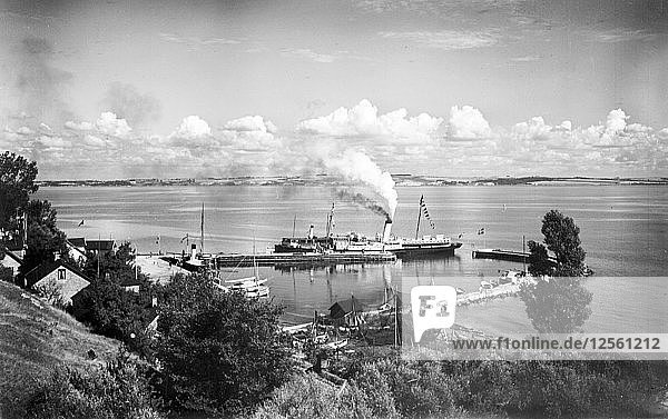 Steamboat in the harbour of Bäckviken  Isle of Ven  Sweden  1925. Artist: Unknown