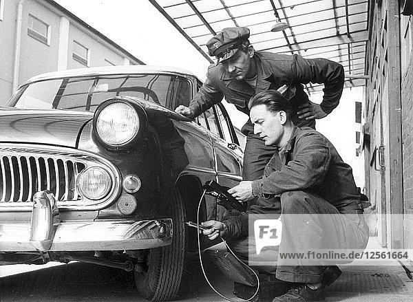 Service at a garage  Trelleborg  Sweden  1950s. Artist: Unknown