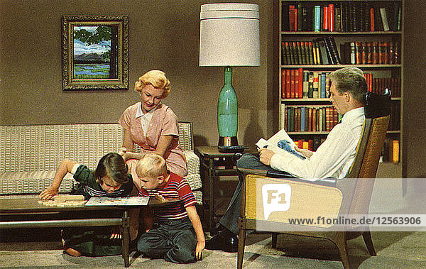 Family sitting in their living room  USA  1962. Artist: Unknown