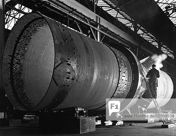 A rotary kiln section being welded in preparation for installation  Steetley  Nottinghamshire  1962. Artist: Michael Walters