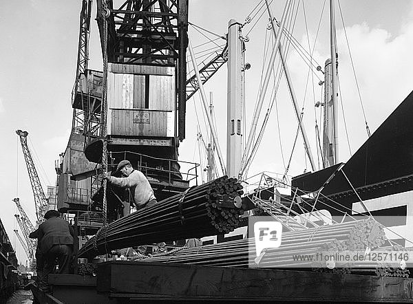 Dockers loading steel bars onto the Manchester Renown  Manchester  1964. Artist: Michael Walters