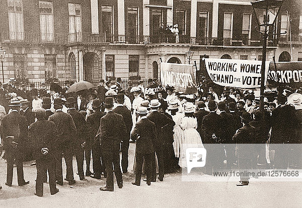 Spectators gather on Portland Place to watch the Womens Sunday procession London 21 June 1908. Artist: Unknown