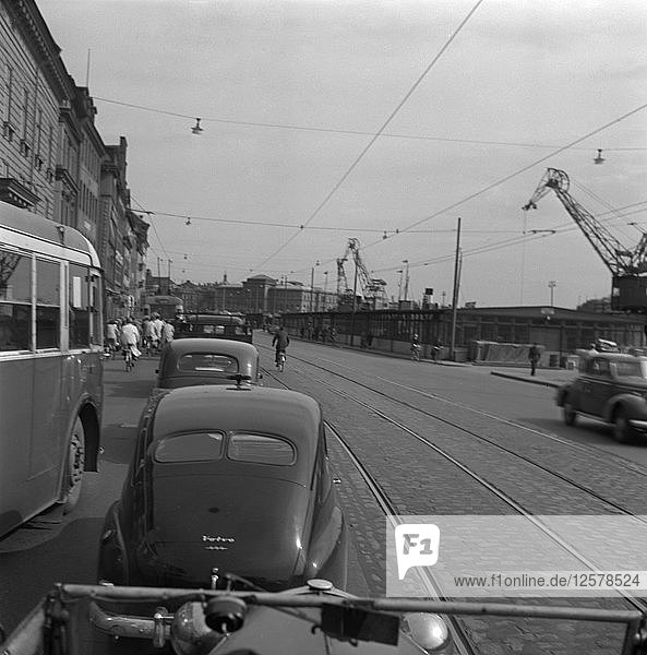 Heavy traffic outside the Royal Palace  Stockholm  Sweden  1950. Artist: Torkel Lindeberg