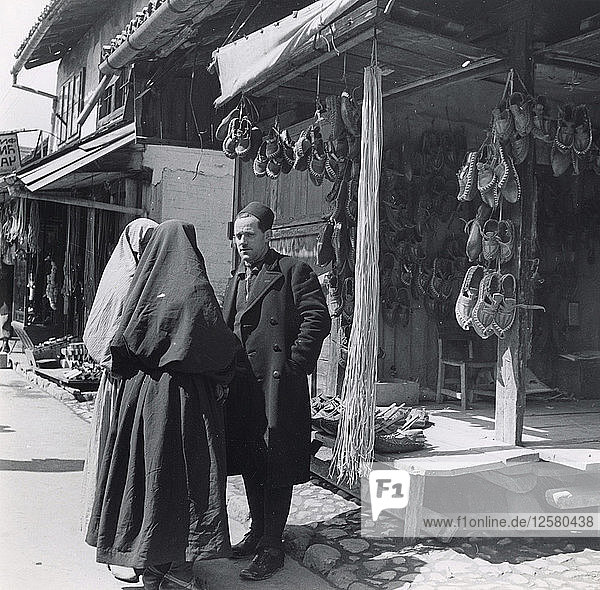 Muslim women talking to a man  Bosnia-Hercegovina  Yugoslavia  1939. Artist: Unknown