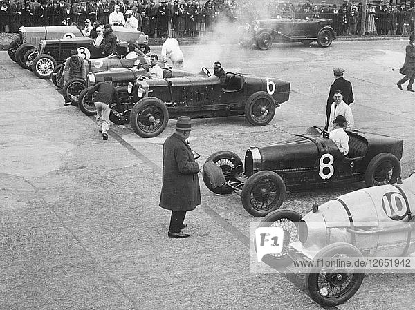Cars on the start line at a BARC meeting  Brooklands  1930. Artist: Bill Brunell.