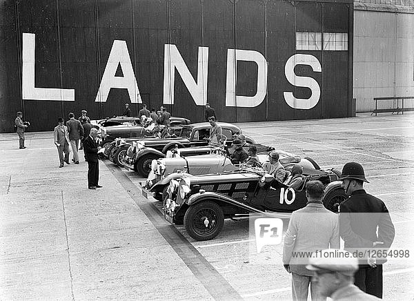 Cars on the start line at the MCC Members Meeting  Brooklands  10 September 1938. Artist: Bill Brunell.