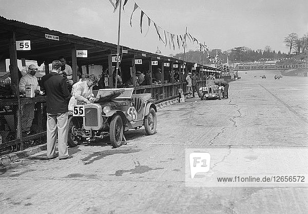 Austin Ulster and MG C type in the pits at the JCC Double Twelve race  Brooklands  8/9 May 1931. Artist: Bill Brunell.
