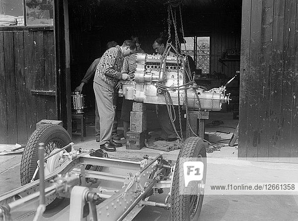 Working on the engine of Raymond Mays Vauxhall-Villiers  c1930s. Artist: Bill Brunell.