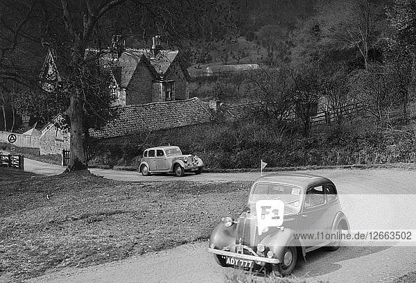 Vauxhall 10 of Miss IM Burton amd Rover of CG Dunham competing in the RAC Rally 1939. Artist: Bill Brunell.