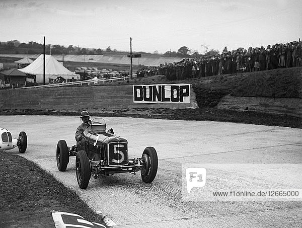 ERA and Maserati taking a corner in a race at Brooklands. Artist: Bill Brunell.