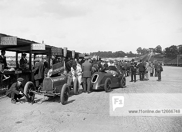 Bugatti Special 1 and Gwynne Special in the pits at a BARC meeting  Brooklands  1933. Artist: Bill Brunell.