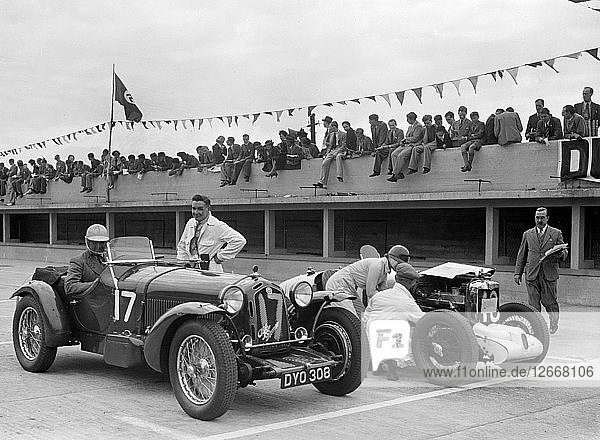 Alfa Romeo and supercharged MG Midget on the start line at Brooklands  1938 or 1939. Artist: Bill Brunell.