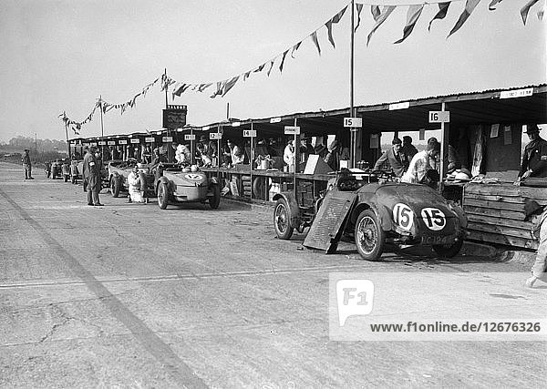 Talbot 105 and Lea-Francis cars in the pits at the JCC Double Twelve race  Brooklands  8/9 May 1931. Artist: Bill Brunell.