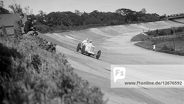 Sunbeam of EL Bouts on the banking  BARC meeting  Brooklands  16 May 1932. Artist: Bill Brunell.