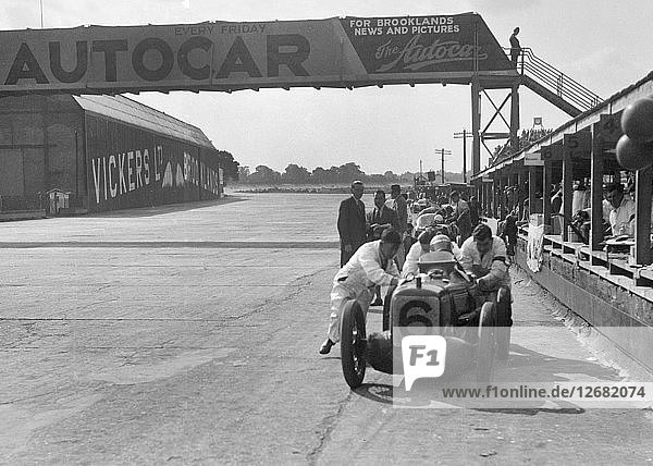 Rubber Duck  works Austin 7 of Charles Goodacre in the pits  BRDC 500 Mile Race  Brooklands  1931. Artist: Bill Brunell.