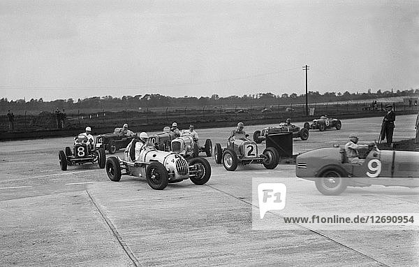 Cars racing at the BARC Meeting on the Campbell Circuit  Brooklands  15 October 1938. Artist: Bill Brunell.