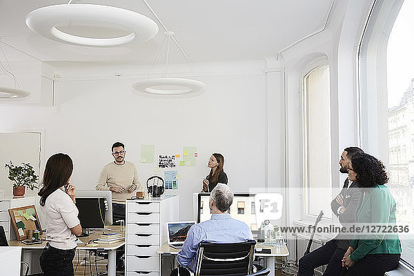Business coworkers discussing in meeting at office