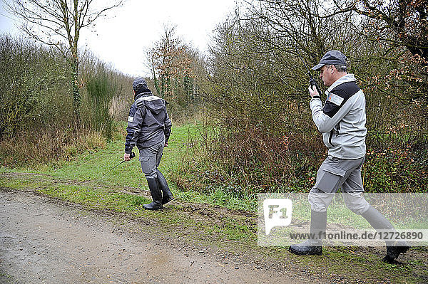 France  officers of French environmental policy on patrol in forest during a hunt in Loire-Atlantique Department.