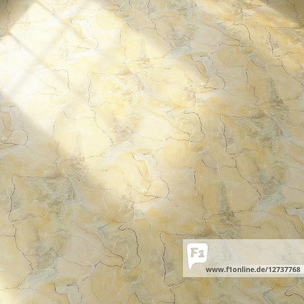 3D rendering  Yellow marble floor with light effects