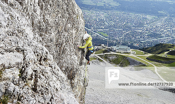 Austria  Innsbruck  Nordkette  woman climbing in rock wall