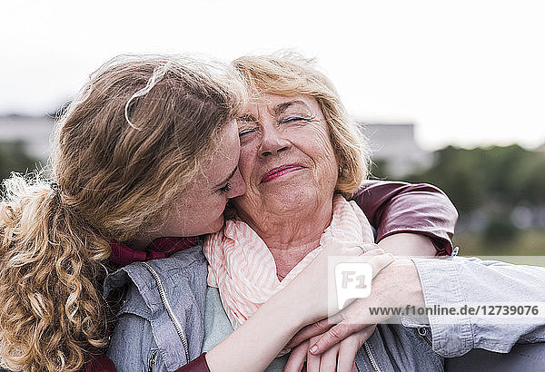 Portrait of happy grandmother with her granddaughter