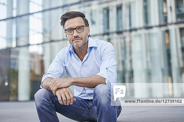 Portrait of relaxed businessman outdoors