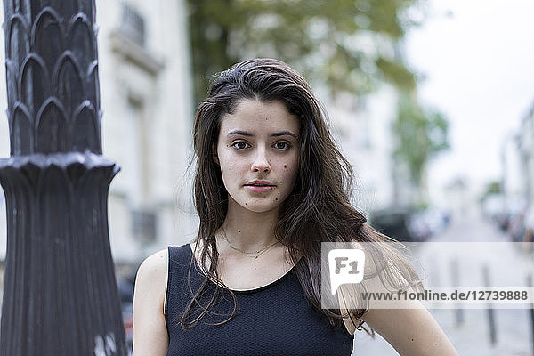 Portrait of beautiful young woman in the city