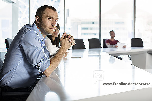 Business people sitting in conference room