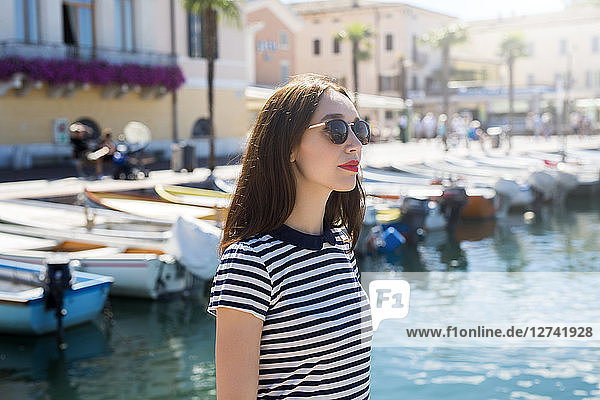 Italy  Bardolino  Lake Garda  portrait of young woman wearing sunglasses