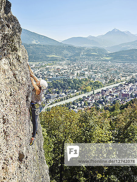 Austria  Innsbruck  Hoettingen quarry  woman climbing in rock wall