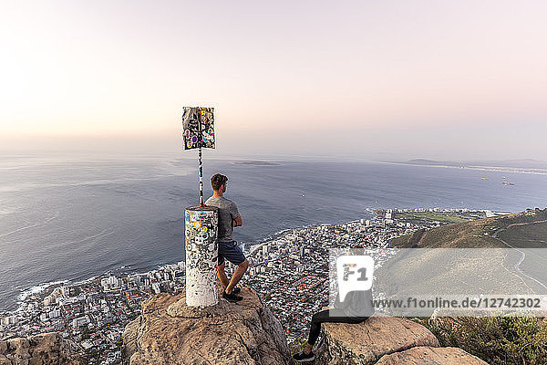 South Africa  Cape Town  Lions Head  Sea Point  couple enjoying the view at sunset