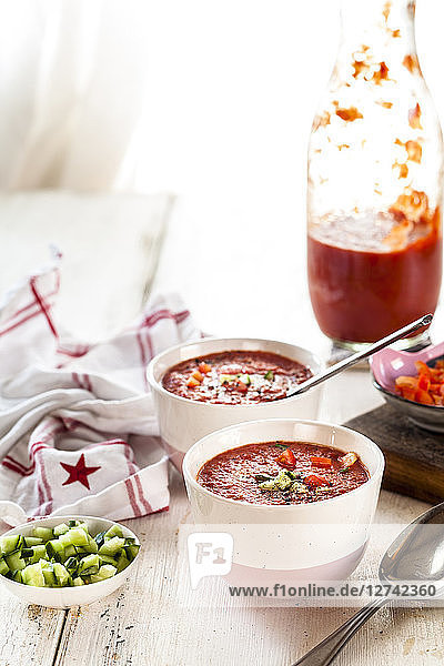 Bowl of Gazpacho with cucumber and bell pepper topping