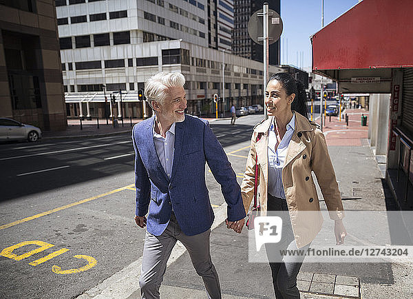 Mature couple walking in the city