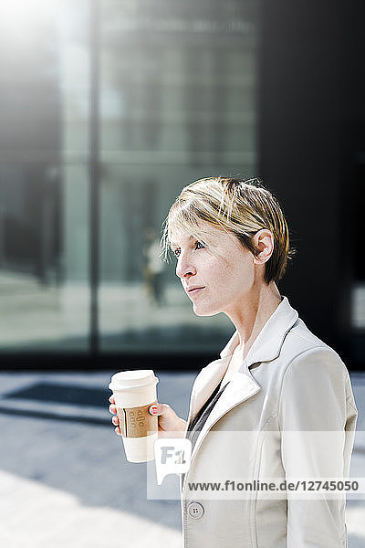 Portrait of businesswoman with Coffee to go