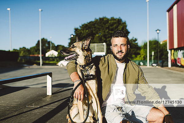 Portrait of young man with his dog