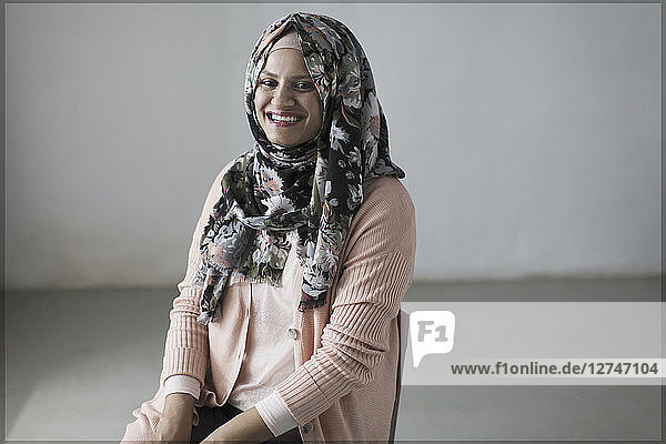 Portrait smiling  confident woman in floral hijab