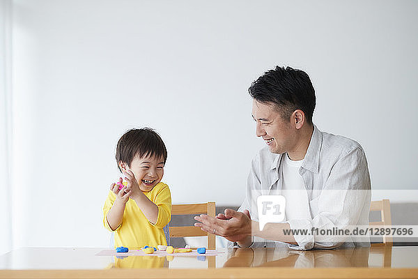 Japanese father and kid playing