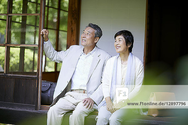 Japanese senior couple having fun at traditional inn