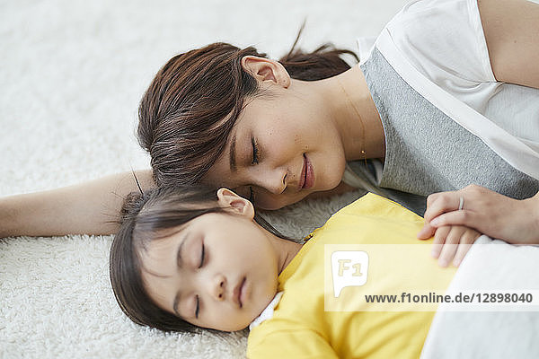 Japanese mother with sleeping kid