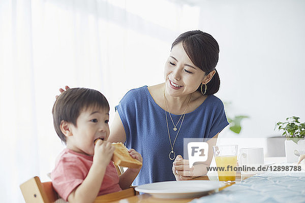 Japanese mother and kid having breakfast