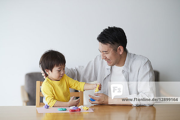 Japanese father and kid playing