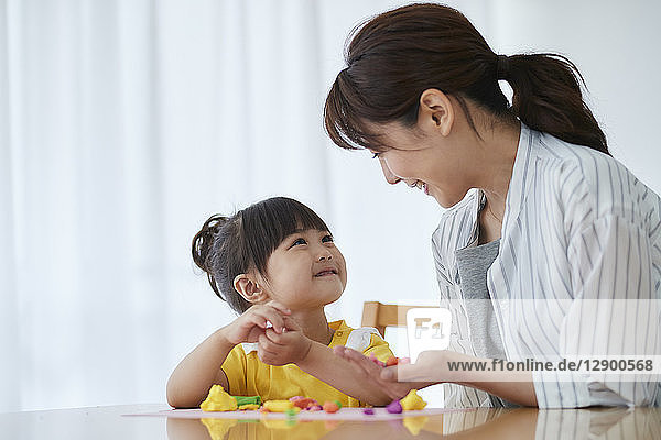 Japanese mother and kid playing