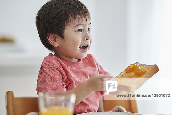 Japanese kid having breakfast