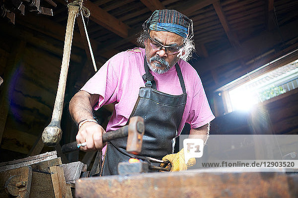 Blacksmith working in his forge